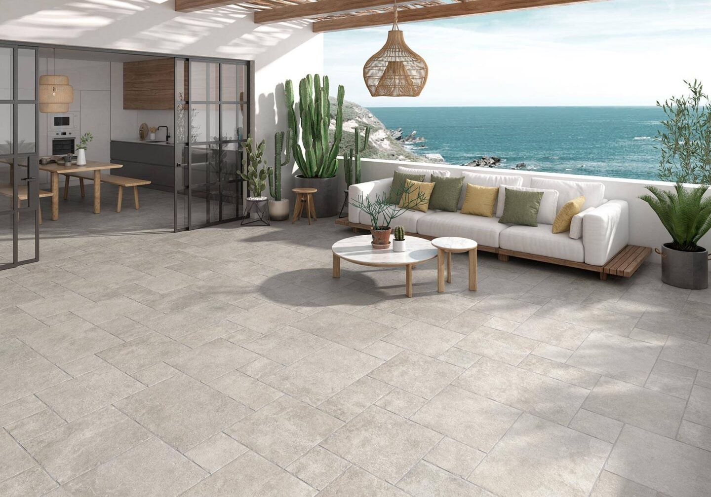 Agora-Stone-Sofa-outdoors-grey-floor-tiles-with-view-of-the-ocean
