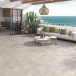 Agora-Stone-Sofa-outdoors-grey-floor-tiles-with-view-of-the-ocean