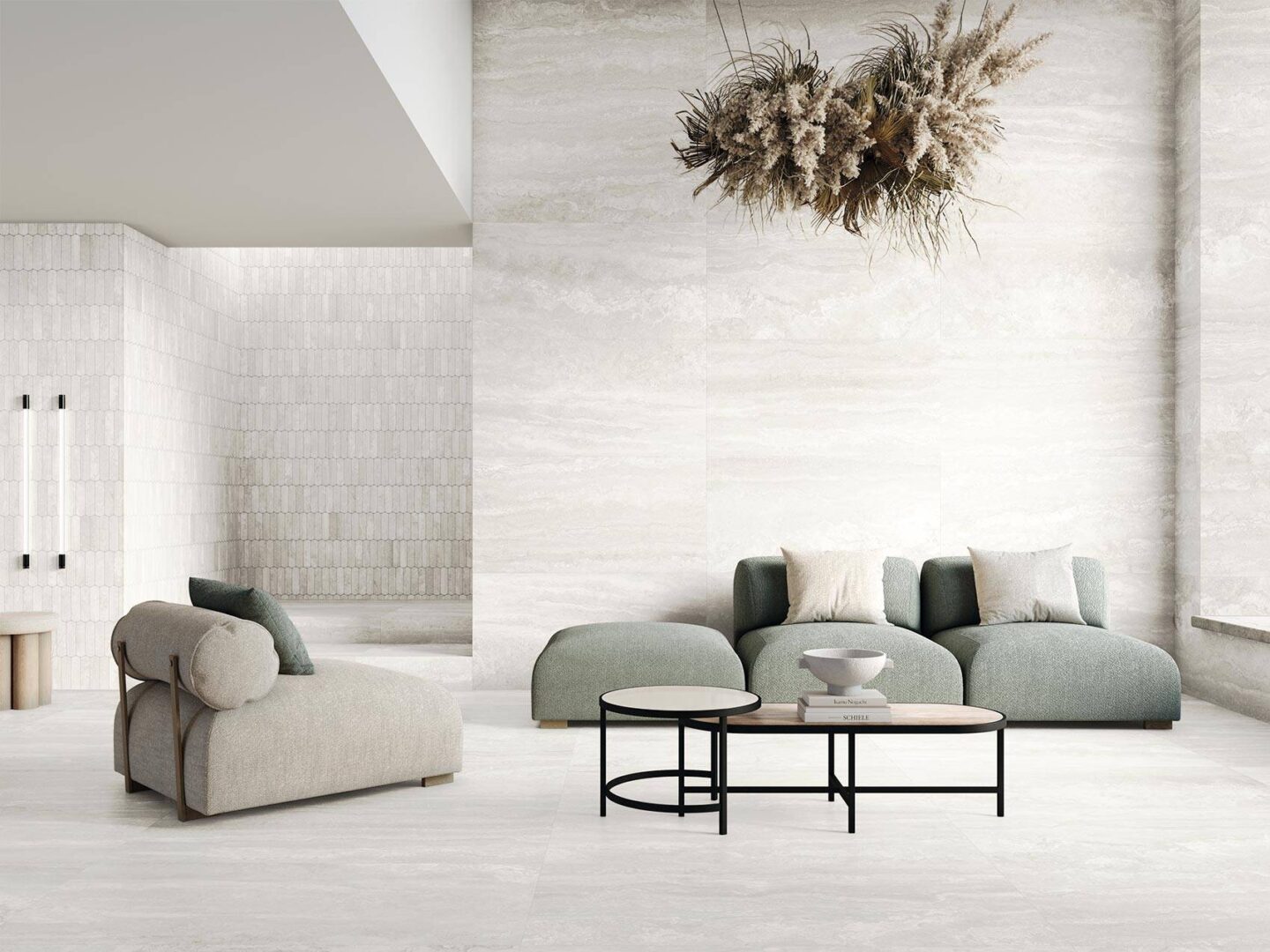 Sofa-and-chair-with-light-tiles-on-floor-and-walls-and-dried-flower-creation-hanging-from-ceiling