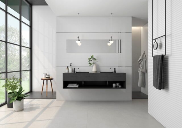 bathroom furniture with light tiles and black washing basin