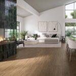 Livingroom-with-woodlike-floor-tiles-fireplace-sofa-and-dining-table