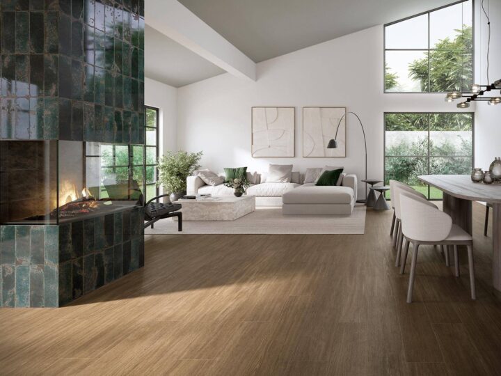 Livingroom-with-woodlike-floor-tiles-fireplace-sofa-and-dining-table