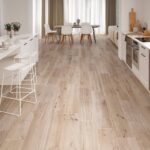 Kitchen-with-woodlike-floor-tiles-island-and-dining-table