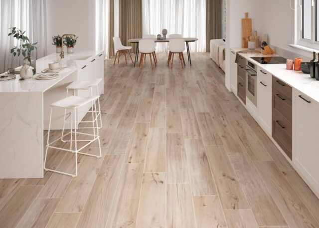 Kitchen-with-woodlike-floor-tiles-island-and-dining-table