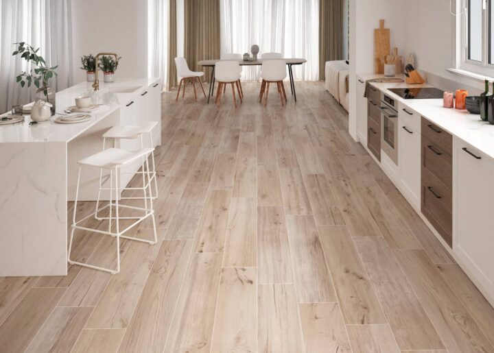 Kitchen-with-woodlike-floor-tiles-island-and-dining-table