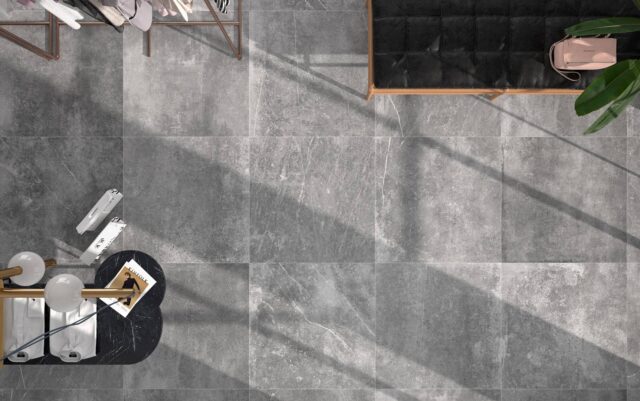 Grey_wardrobe-and-small-table-seen-from-above-on-grey-tiles