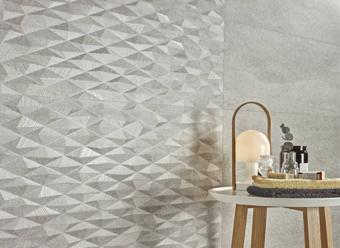 Nara-Grey_table-in-bathroom-with-towels-soaps-and-light