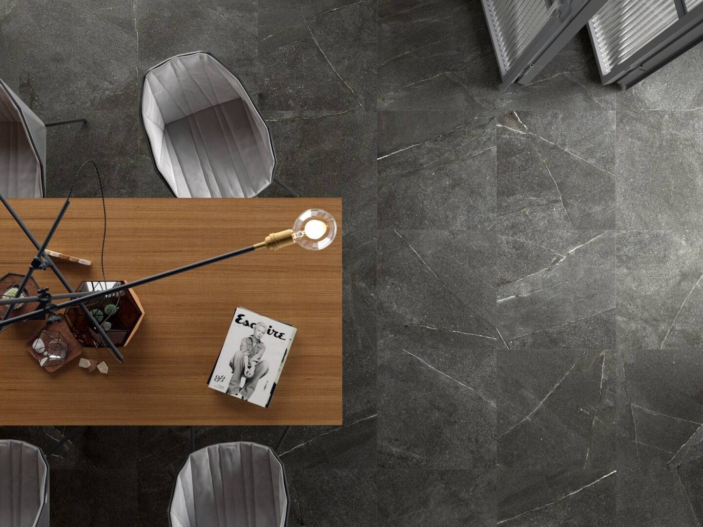 Grafito-table-on-dark-tiles-seen-from-above