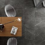 Grafito-table-on-dark-tiles-seen-from-above