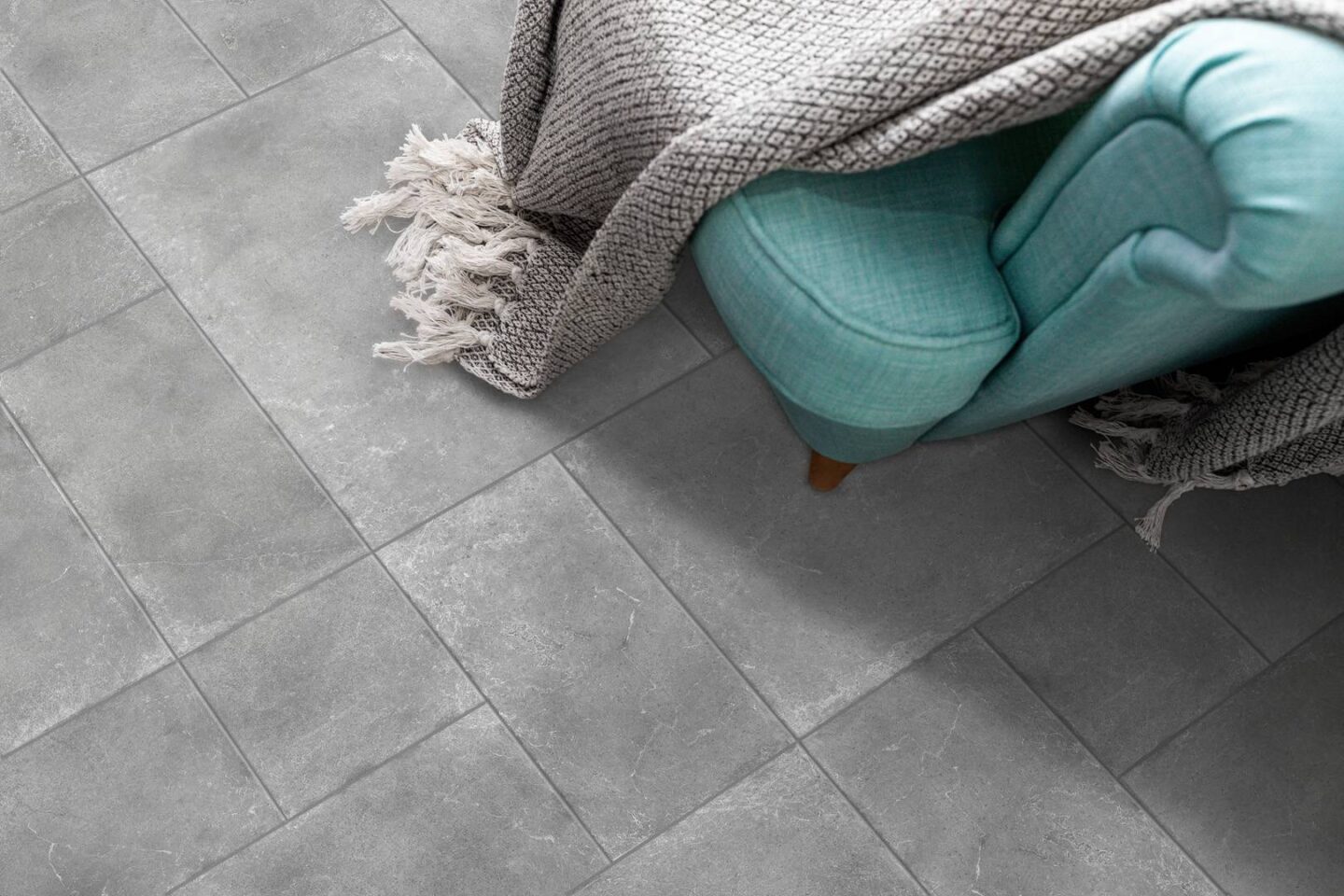 Pearl-blue-chair-with-blanket-on-pearl-tiles