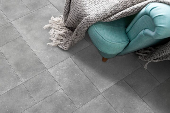 Pearl-blue-chair-with-blanket-on-pearl-tiles