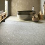 Tangram-bathroom-with-round-bathtub-on-tile-floor