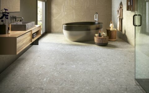 Tangram-bathroom-with-round-bathtub-on-tile-floor