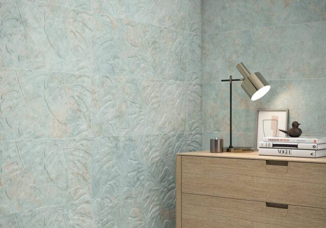 Bedroom-with-palm-patterned-tiles-and-drawer-with-books