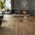 Livingroom-with-woodlike-tiles-fireplace-and-sofa