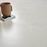 Creme colored floor tiles with a decor on a book