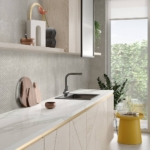 Kitchen with creme color floor and wall tiles with a kitchen counter