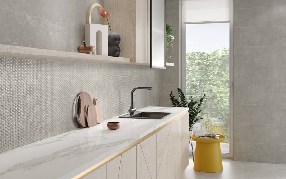 Kitchen with creme color floor and wall tiles with a kitchen counter