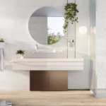 Bathroom with white wall tiles and white basin