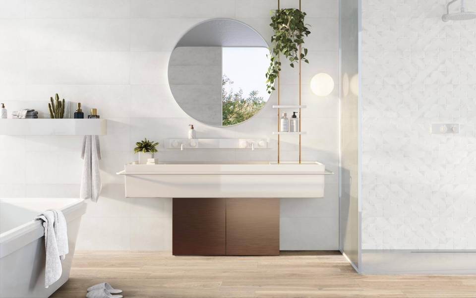 Bathroom with white wall tiles and white basin