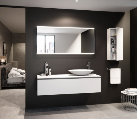Modern bathroom with black walls, white vanity, backlit mirror, and adjacent bedroom view.