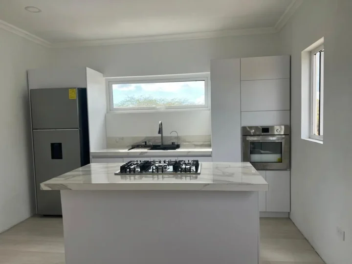 A white-marbled-kitchen-countertop-with-a-stove