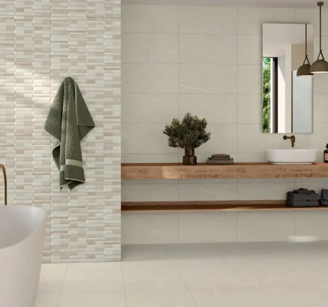 Warm creme colored wall tiles in bathroom with a tub and sink