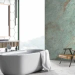 Bathroom with green color chlorophyll wall tiles with a bathtub and sink