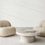 white creme wall tile in living room with 2 chairs and table